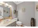 Cozy powder room boasts updated vanity, natural light and hardwood floors at 2145 Kensington Sw Ct, Marietta, GA 30064