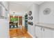 Hallway view of dining room with backyard views, hardwood floors and elegant lighting at 2145 Kensington Sw Ct, Marietta, GA 30064