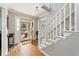 Elegant foyer with hardwood floors and staircase at 2145 Kensington Sw Ct, Marietta, GA 30064