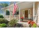 Inviting front porch with American flag and cozy seating at 2145 Kensington Sw Ct, Marietta, GA 30064