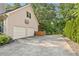 Attached two-car garage with a long driveway and a basketball hoop at 2145 Kensington Sw Ct, Marietta, GA 30064