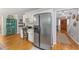Bright eat-in kitchen features stainless steel refrigerator and custom built-ins at 2145 Kensington Sw Ct, Marietta, GA 30064