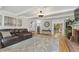 Spacious living room with hardwood floors, comfortable seating, and bright backyard views at 2145 Kensington Sw Ct, Marietta, GA 30064