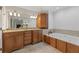Main bathroom features double vanity, garden tub, tile flooring and a neutral color palette at 2145 Kensington Sw Ct, Marietta, GA 30064