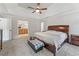 Large main bedroom boasts a tray ceiling, plush carpet, natural light, and a spa-like ensuite bathroom at 2145 Kensington Sw Ct, Marietta, GA 30064
