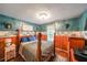A cozy bedroom showcases wood paneling and a decorative accent, blending comfort with classic style at 295 Pinehurst Dr, Stockbridge, GA 30281