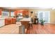Eat-in kitchen with wood cabinets, tile flooring, and a breakfast bar with stools at 295 Pinehurst Dr, Stockbridge, GA 30281
