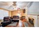 Cozy living room featuring hardwood floors, fireplace, and comfortable leather seating at 295 Pinehurst Dr, Stockbridge, GA 30281