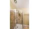 Shower stall has textured brick tile in the shower, matching flooring, and a fixed shower head at 295 Pinehurst Dr, Stockbridge, GA 30281