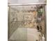 The shower has decorative patterned tile and grab bars for safety at 295 Pinehurst Dr, Stockbridge, GA 30281