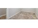Unfinished basement space with concrete floor and white trim along the walls; electrical outlets visible at 3115 Chimney Cove Ln, Cumming, GA 30041