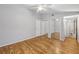 Spacious bedroom with hardwood floors, mirrored closet, and ensuite bathroom at 3115 Chimney Cove Ln, Cumming, GA 30041