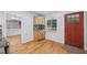 Bright eat-in kitchen showcasing wood floors, matching cabinets and stainless appliances, leading into a dining space at 3115 Chimney Cove Ln, Cumming, GA 30041