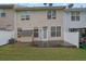 Townhome backyard featuring a fenced yard and patio with an additional small shed, great for outdoor enjoyment at 4055 Hill Station Ct, Sugar Hill, GA 30518
