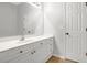 Bathroom featuring a sink, white cabinets, and a large mirror, providing a clean and functional space at 4055 Hill Station Ct, Sugar Hill, GA 30518