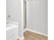 Bathroom showcasing a shower with glass doors and tile flooring, providing a clean and practical space at 4055 Hill Station Ct, Sugar Hill, GA 30518