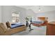 Bedroom with lots of natural light features two windows, an exercise bike, and a comfortable bed at 4055 Hill Station Ct, Sugar Hill, GA 30518