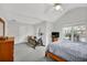 Light-filled bedroom boasts a ceiling fan, exercise bike, a window, and light-colored walls, creating an active space at 4055 Hill Station Ct, Sugar Hill, GA 30518