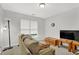 Cozy bedroom featuring a comfortable sofa, TV and window with natural light at 4055 Hill Station Ct, Sugar Hill, GA 30518