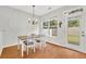 Bright dining area with a chandelier and view of the outdoor patio at 4055 Hill Station Ct, Sugar Hill, GA 30518