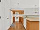 Functional kitchen with wooden cabinets and white appliances at 4055 Hill Station Ct, Sugar Hill, GA 30518