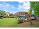 A sprawling backyard with mature trees and lush greenery and a private area to entertain at 425 Starfire Ct, Suwanee, GA 30024