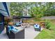 A lovely outdoor living area featuring comfortable seating, a dining set, and an elegant hot tub at 425 Starfire Ct, Suwanee, GA 30024