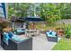 The backyard offers an inviting patio with an outdoor hot tub, seating, and landscaped surroundings at 425 Starfire Ct, Suwanee, GA 30024