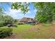 A lush green lawn and mature trees define this spacious backyard, perfect for outdoor enjoyment at 425 Starfire Ct, Suwanee, GA 30024