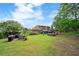 Spacious backyard features a lush lawn, seating area, and outdoor cooking space, perfect for entertaining at 425 Starfire Ct, Suwanee, GA 30024