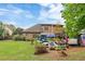 Beautiful backyard offers a patio with ample seating, a hot tub, and a well-manicured lawn at 425 Starfire Ct, Suwanee, GA 30024