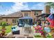Enjoy a relaxing backyard, complete with patio, outdoor furniture and lush landscaping at 425 Starfire Ct, Suwanee, GA 30024