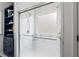 Modern bathroom with a glass-enclosed shower with tiled walls and blue built-ins at 425 Starfire Ct, Suwanee, GA 30024