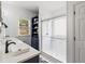 Bright bathroom with dual sinks, modern fixtures, and a glass-enclosed shower at 425 Starfire Ct, Suwanee, GA 30024