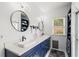 Elegant bathroom with dual sinks, modern fixtures, and a glass-enclosed shower at 425 Starfire Ct, Suwanee, GA 30024