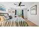 Inviting bedroom with a ceiling fan, a dedicated desk area, and window at 425 Starfire Ct, Suwanee, GA 30024