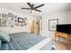 Bright bedroom showcases a collection of photos on the wall and a glimpse into the bathroom at 425 Starfire Ct, Suwanee, GA 30024