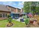 The home's backyard features an outdoor kitchen, patio, seating, and a lovely green lawn at 425 Starfire Ct, Suwanee, GA 30024