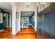 Inviting foyer with hardwood floors, elegant lighting, and views into the adjacent living spaces at 425 Starfire Ct, Suwanee, GA 30024
