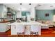 Spacious kitchen with bar seating, stainless appliances, and open access to the living area at 425 Starfire Ct, Suwanee, GA 30024