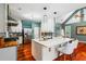 Open kitchen with eat-in island, stainless steel appliances, and pendant lighting at 425 Starfire Ct, Suwanee, GA 30024