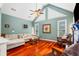 Bright living room featuring vaulted ceilings, a fireplace, and comfortable seating at 425 Starfire Ct, Suwanee, GA 30024