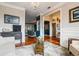 Open concept living room with stylish decor, hardwood floors, and a view into the dining area at 425 Starfire Ct, Suwanee, GA 30024