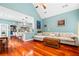 Open-concept living room with kitchen, hardwood floors, and neutral decor at 425 Starfire Ct, Suwanee, GA 30024