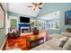 Bright living room featuring hardwood floors, a fireplace, and comfortable seating at 425 Starfire Ct, Suwanee, GA 30024