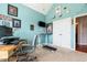 Home office with modern treadmill desk and view of the closet and hallway at 425 Starfire Ct, Suwanee, GA 30024