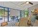 Screened patio featuring seating, a projector screen, and a view of the backyard's outdoor living space at 425 Starfire Ct, Suwanee, GA 30024