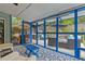 This covered patio offers an outdoor living space with comfortable seating and a view of the backyard at 425 Starfire Ct, Suwanee, GA 30024