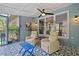Cozy sunroom featuring two reclining chairs, patterned tile floors, and ample light at 425 Starfire Ct, Suwanee, GA 30024