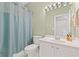 Bathroom featuring a vanity with white cabinets, a toilet, and a shower curtain at 6360 Waveland Dr, Cumming, GA 30040
